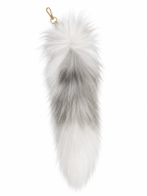 A fox fur tail, featuring a white and gray gradient with a small gold metal clasp at the top, shown on a plain white background.