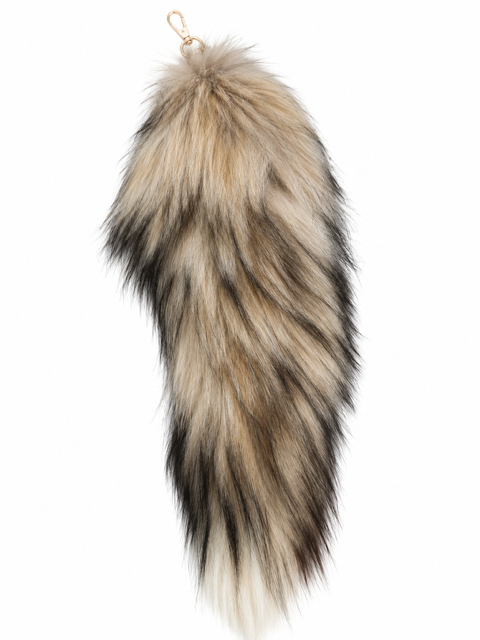 A long, fluffy fox fur tail accessory with a natural animal pattern in beige, brown, black, and cream, featuring a small gold metal ring at the top, shown against a plain white background.