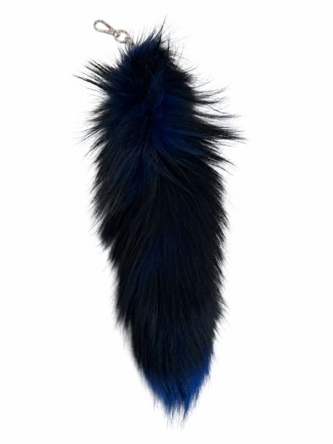 A long, fluffy fox-fur keychain or bag charm in a dark blue gradient, featuring a silver metal lobster clasp at the top, shown against a plain white background.